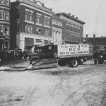 3-ton REO truck in front of Snell House and Temple Theatre, ca. 1928-29